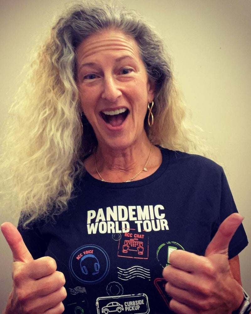Customer giving two thumbs up in the Pandemic World Tour shirt