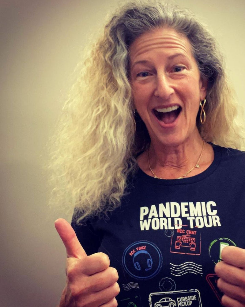 Customer giving two thumbs up in the Pandemic World Tour shirt