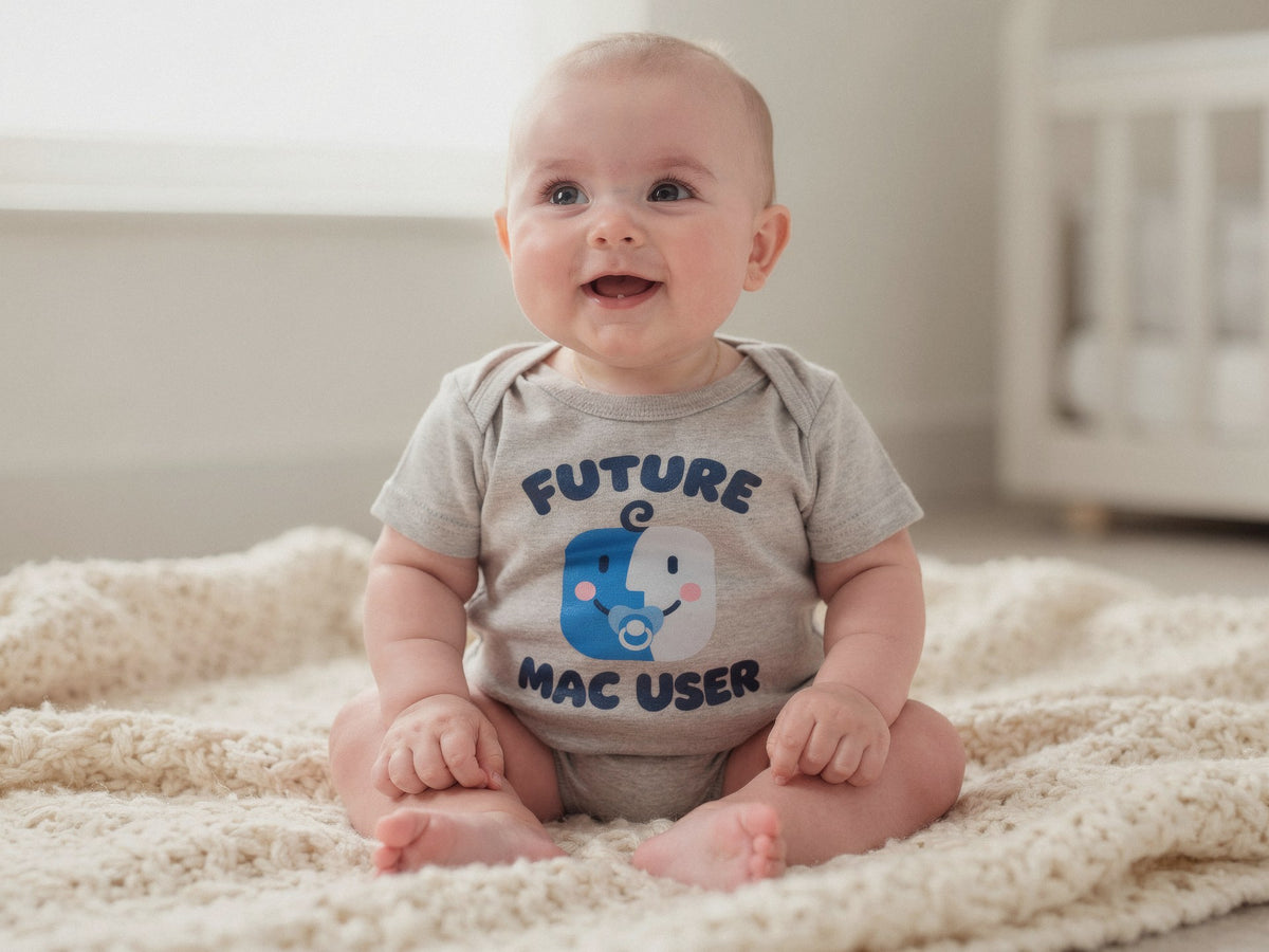 Baby sitting on a knit blanket wearing the Future Mac User: Pacifier bodysuit in Athletic Heather
