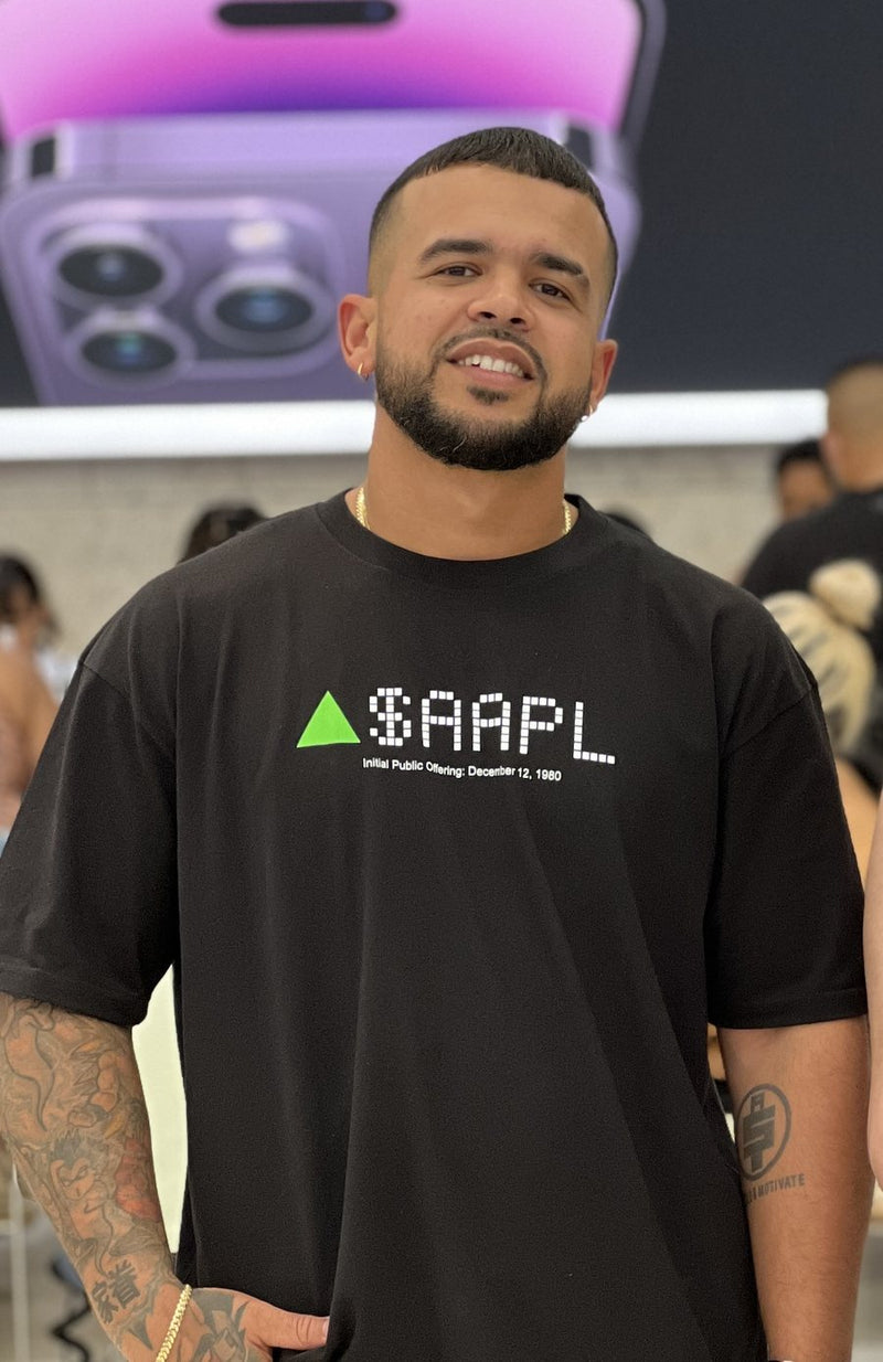 Man in an Apple Store wearing the AAPL Stock Ticker tee
