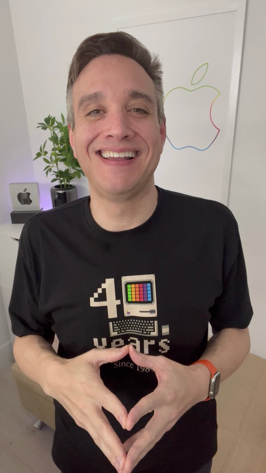 Gabe Iglesias, founder, in the Macintosh 40 Years tee, making a heart with his hands